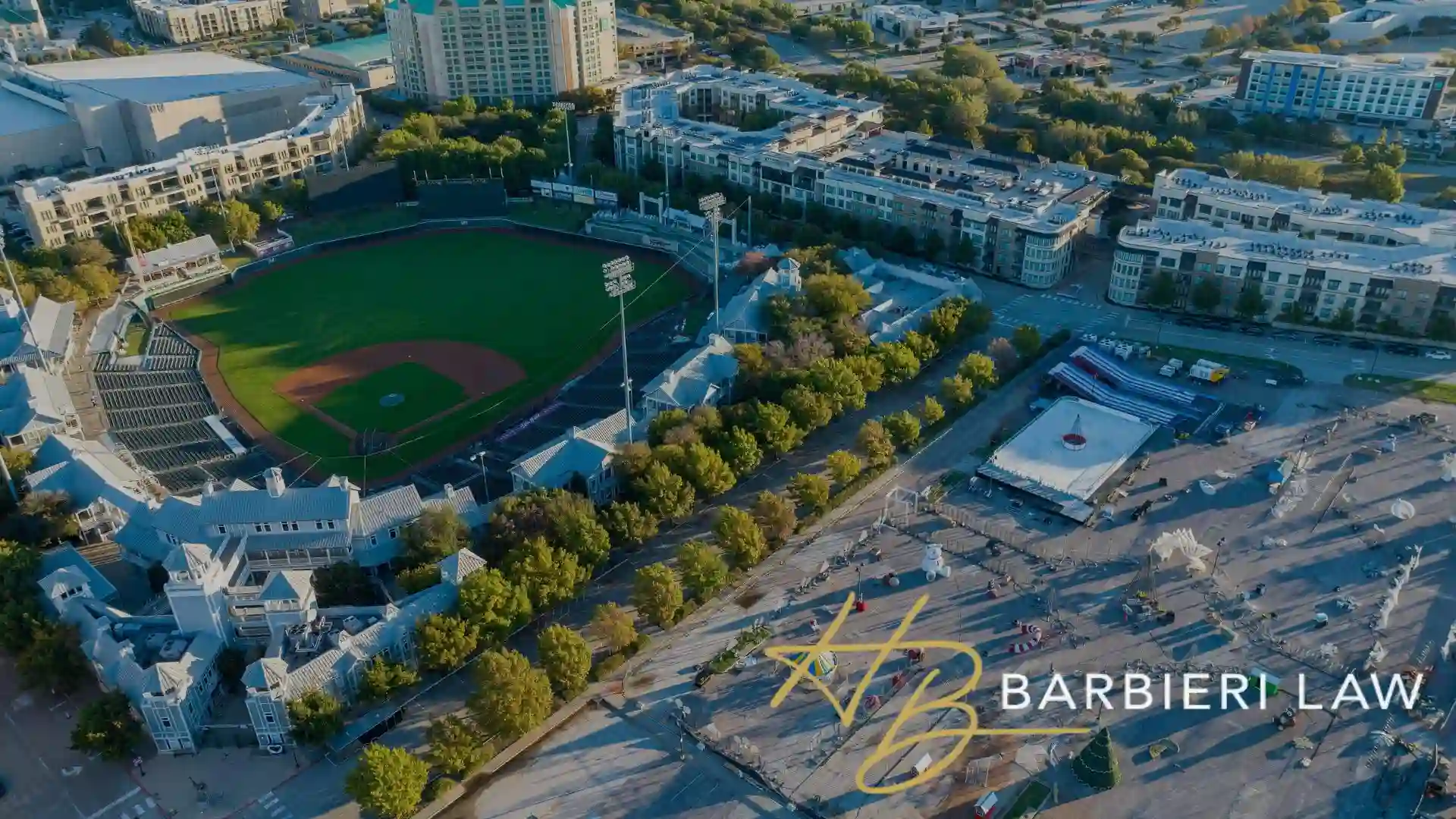 FRISCO, US - Nov 12, 2022: An aerial shot of Frisco Roughriders Minor League Baseball Stadium surrounded by other modern urban buildings, where residents need legal assistance with Juvenile crimes.