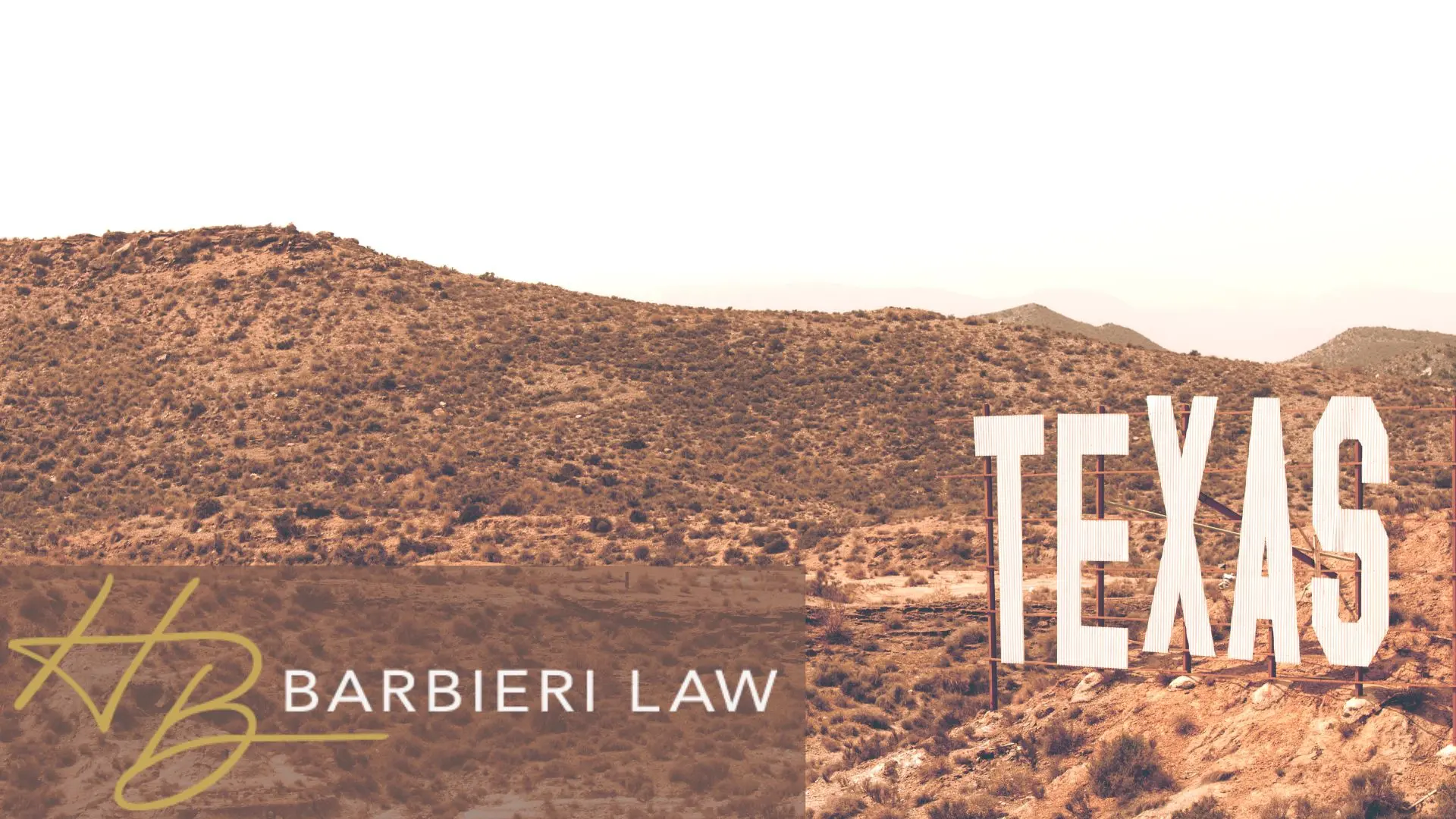 Large Texas sign on desert hillside